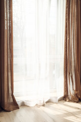 Fototapeta na wymiar Light curtains on window in room