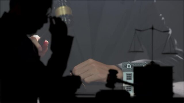 A lawyer tries to understand a court ruling regarding a home property - silhouette of the lawyer in the foreground with double exposure of the judge in court as the background