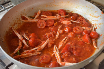scampi and tomatoes in pan