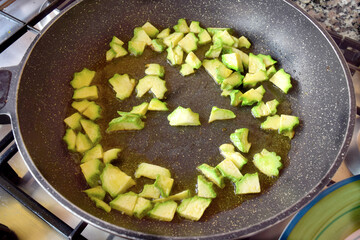 sautéing zucchini in pan