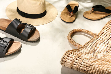 Set of beach accessories on light background