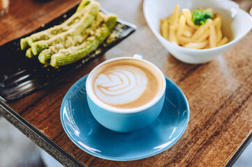 cappuccino coffee on the table with other dishes