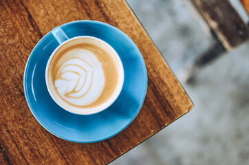 top view of cappuccino coffee on wooden table