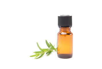 Bottle glass of essential rosemary oil with rosemary branch isolated on white background. Herbal oil concept