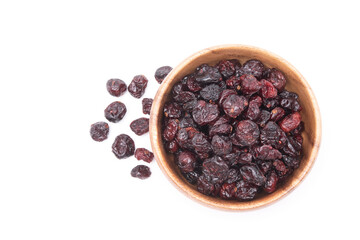 Top view of dried cranberries in wooden bowl isolated on white background.