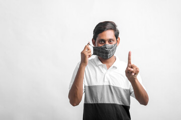 young indian man wearing mask for protection against virus.