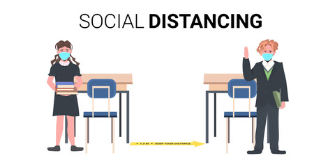 schoolchildren in masks keeping distance to prevent coronavirus pandemic social distancing concept