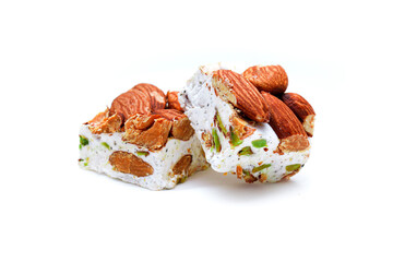 Homemade nougat bars with almonds and dried fruits isolated on white 
