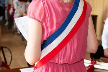 French blonde woman mayor with scarf france flag tricolor and girl pink dress during official...