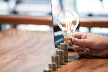 saving coins idea with light bulb for investment Concept idea and innovation.