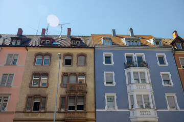 Low angle shot of old brown and blue houses with tile roofs in Konstanz, Germany