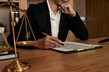 Legal counsel presents to the client a signed contract with gavel and legal law. justice and lawyer...