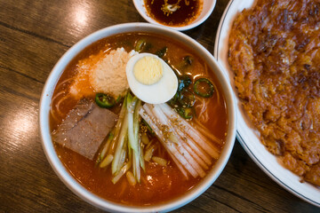 the korea style cold kimchi noodles soup.