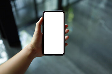 Women's hands holding cell telephone blank copy space screen. smart phone with technology concept