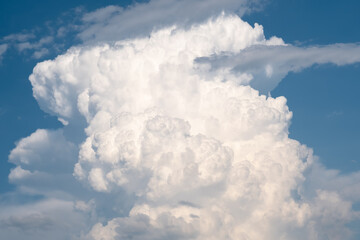 Fototapeta na wymiar white fluffy clouds on blue sky in summer