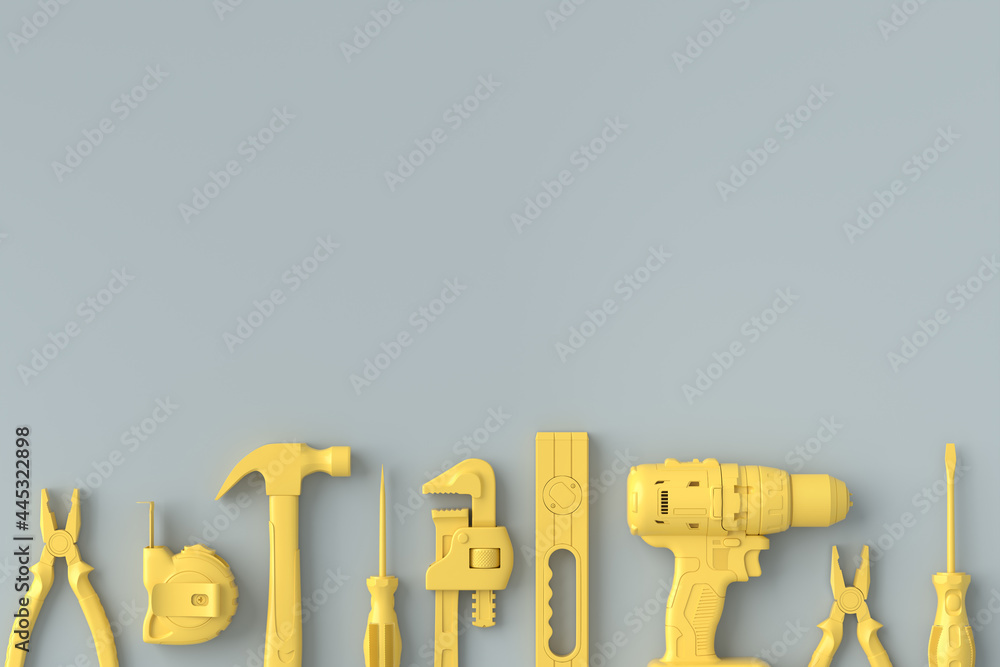 Wall mural Top view of monochrome construction tools for repair on grey and yellow