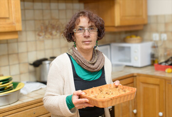 woman makes cake in the kitchen