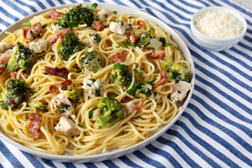 Homemade Chicken Bacon Broccoli Alfredo on a plate, side view. Close-up.