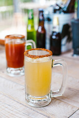 michelada mexican cocktail beer in Mexico city in a mexican party terrace