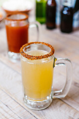 michelada mexican cocktail beer in Mexico city in a mexican party terrace