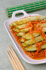 Fermented cucumbers with carrots and spices.
