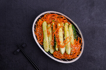 Fermented cucumbers with carrots and spices.