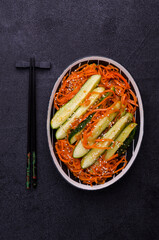 Fermented cucumbers with carrots and spices.