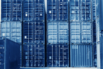 Fototapeta na wymiar container cargo stack on logistic port warehouse blue color tone for shipping transport advertising background.