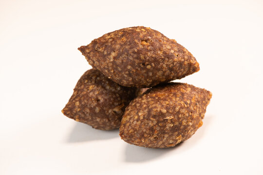 Traditional kebbe and pita bread on big round plate in lebanese restaurant. High quality photo