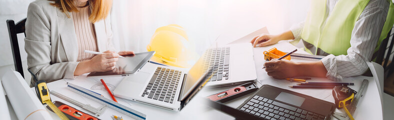 engineer people meeting working and pointing at a drawings in office for discussing. Engineering...