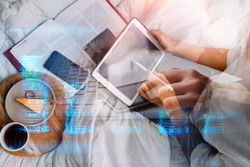 Businesswoman working on laptop computer sitting at home with a dog pet and managing her business via home office during Coronavirus or Covid-19 quarantine