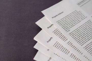 Blank property release forms on a gray table.