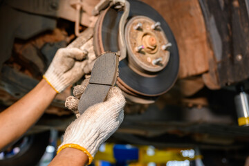 auto repair service changing car brake pads From the old brake pads, change to new brake discs and...