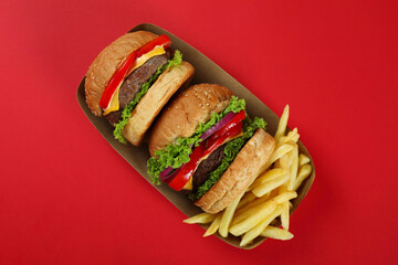 Concept of fast food on red background