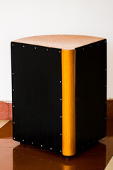 A picture of cajon also known as clap box is a box shaped percussion instrument 

