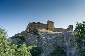 During the day, on the rock there is a fortress from the Middle Ages, the Genoese fortress