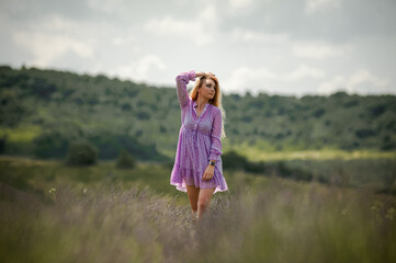 Portrait of smiling blonde woman on the lavender field