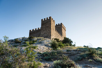 During the day, on the rock there is a fortress from the Middle Ages, the Genoese fortress