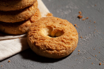 cookies on a white linen napkin on a wooden table. Round biscuits