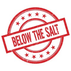 BELOW THE SALT text written on red vintage round stamp.