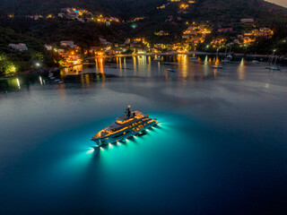 Aerial drone view of modern yacht on kalami beach in corfu island Greece - obrazy, fototapety, plakaty