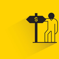 man standing with money signage icon on yellow background