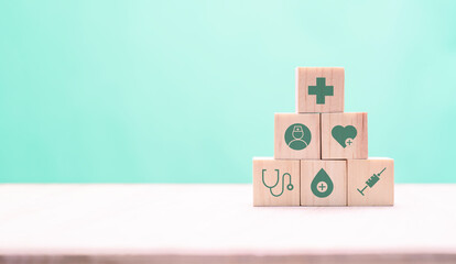Medical icon on wood block. Health insurance banner or backdrop concept.