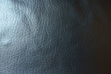 Surface of black faux leather fabric from above