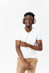 African man wearing headphones in white t-shirt music entertainment lifestyle