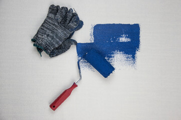 Roller brush painting, Worker painting on surface wall painting apartment, renovating with dark...