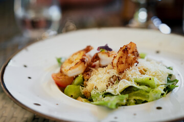 Caesar salad with shrimp or prawn. Gourmet seafood, healthy eating, healthy lifestyle concept.