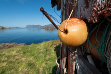 Fishing equipment at a small hut on a fjord near Tromso in northern norway on a bright clear warm summer day
