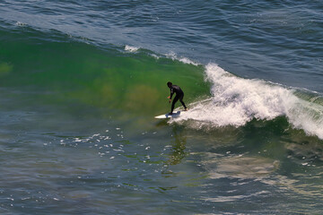 Surfing big summer waves at Point Dume California