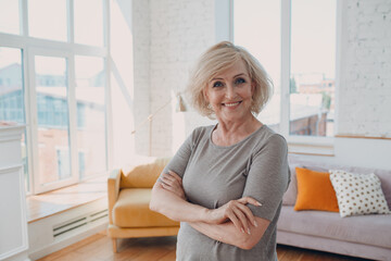 Elderly caucasian old aged woman portrait gray haired positive smiling stand